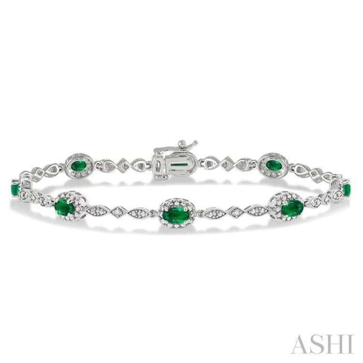 Personalized Wedding Bracelets-5x3MM Oval Cut Emerald and 1/20 Ctw Single Cut Diamond Bracelet in 10K White Gold