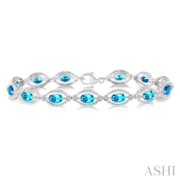 Custom Stackable Bracelets-1/10 Ctw Round Cut Diamond & 6x4MM Oval Cut Blue Topaz Semi Precious Bracelet in Sterling Silver