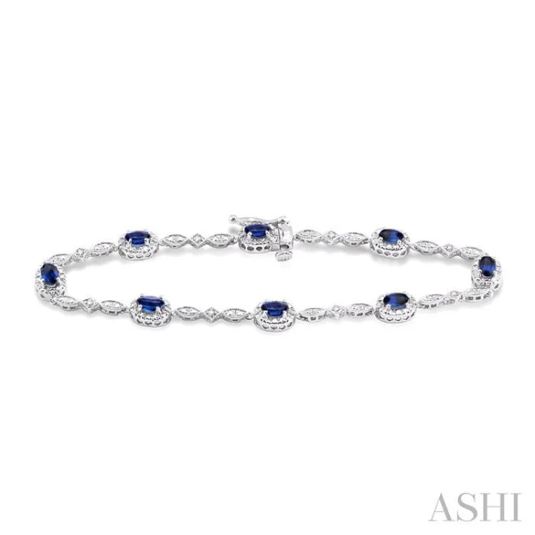 Layered Chain Bracelets-5x3MM Oval Cut Sapphire and 1/20 Ctw Single Cut Diamond Bracelet in 10K White Gold